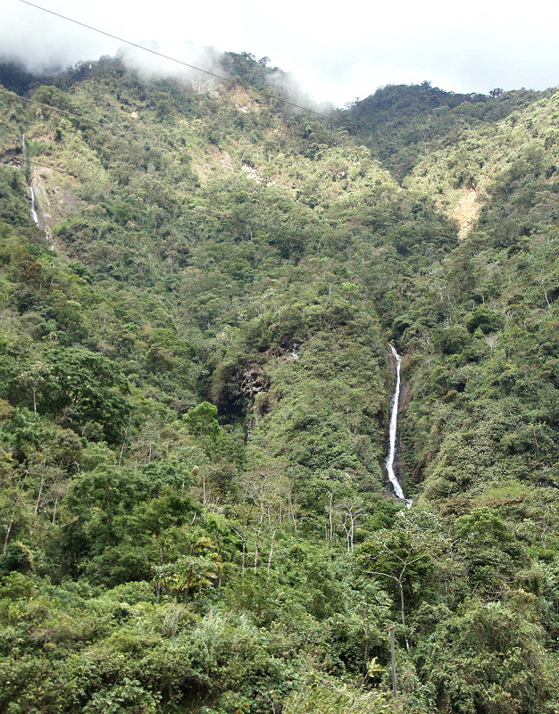 Tropical mountain forest covering steep valley slopes0